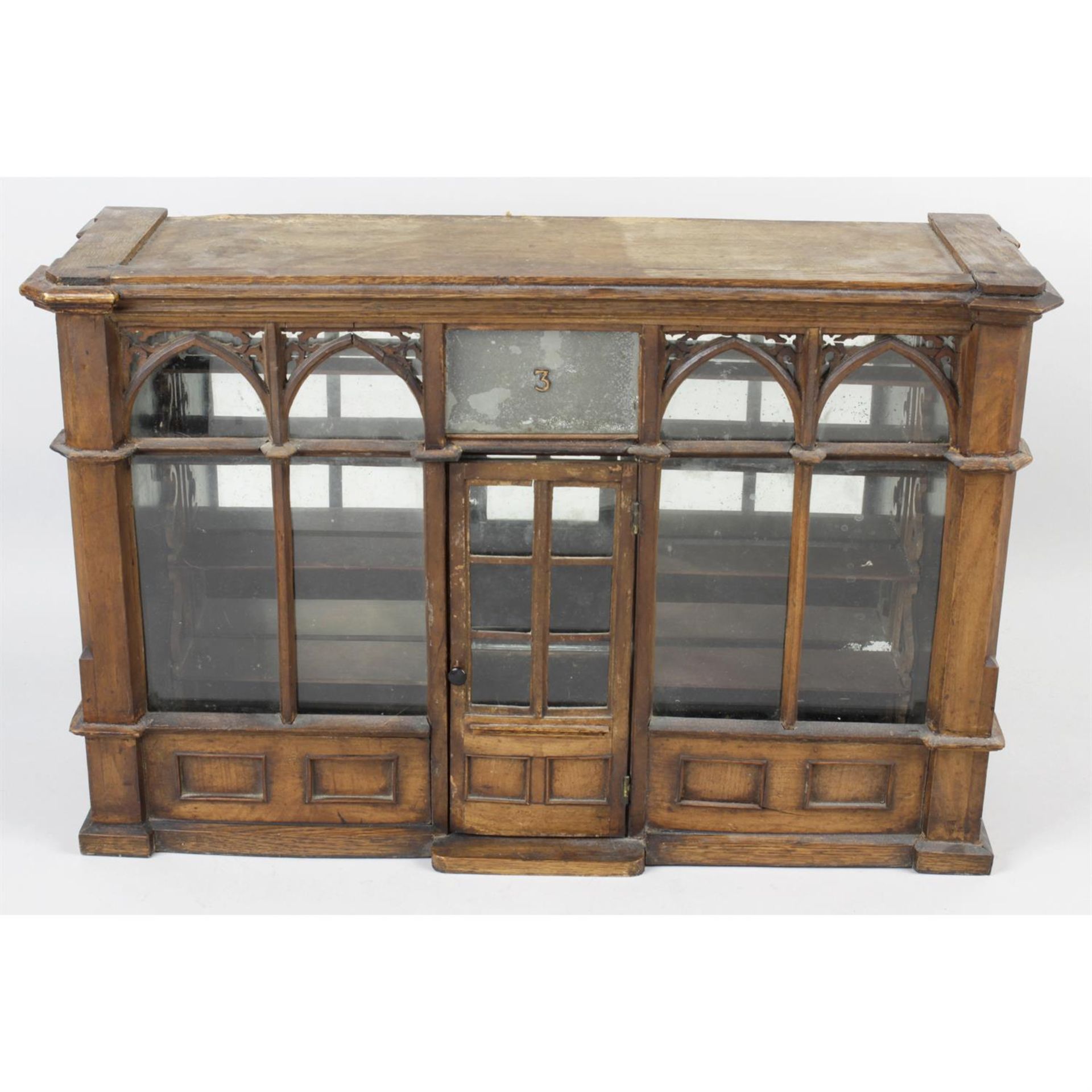 A late 19th century oak and stained wood shop model table display cabinet.