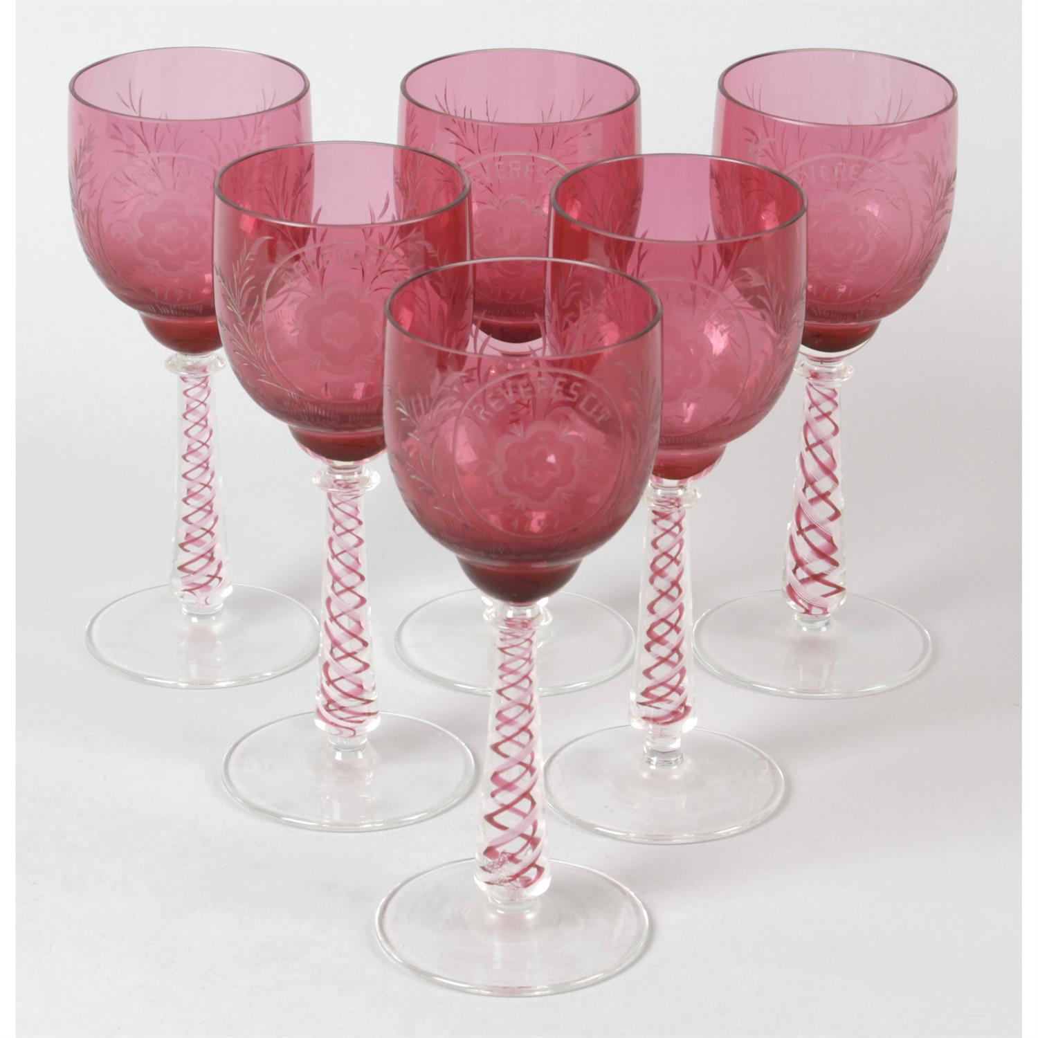 A mixed selection of assorted drinking glasses, to include a set of six wine glasses with cranberry