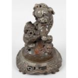 A late 19th century Chinese carved soapstone study of a Foo dog.