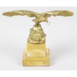 A 19th century gilt metal pocket watch stand modelled as an eagle.