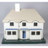 A 1930's Triang model number 3146 'Princess Elizabeth's' dolls house.