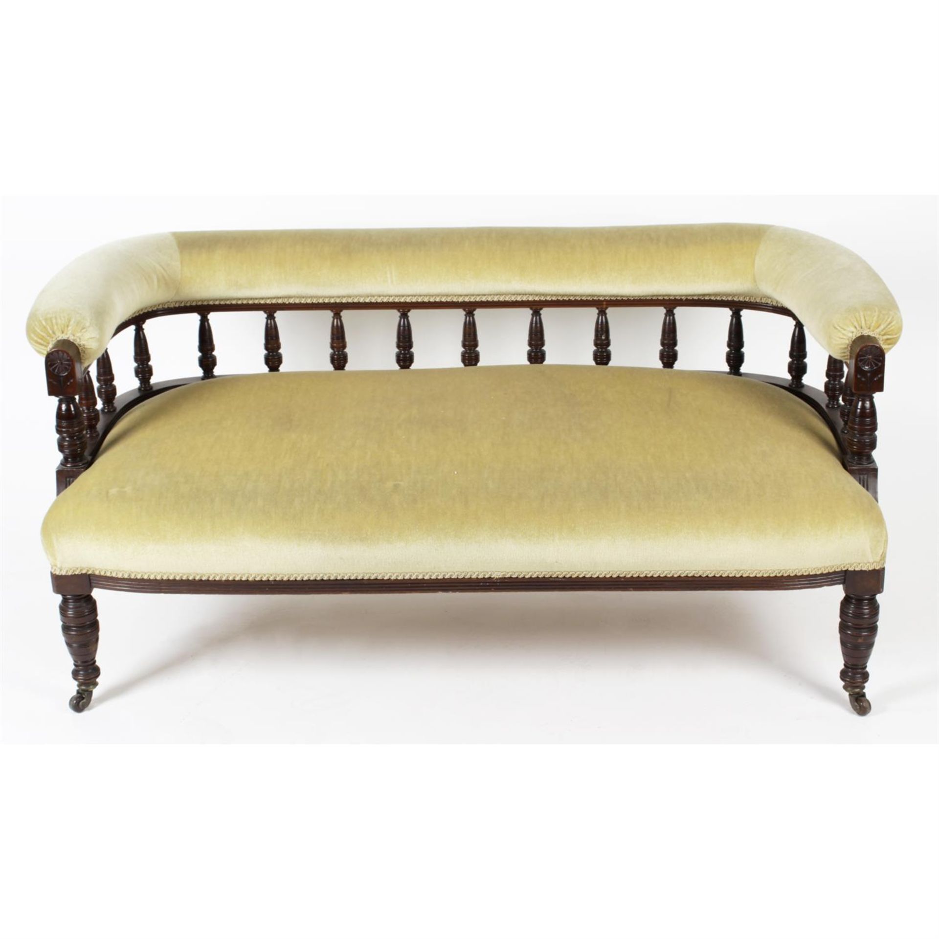 An early twentieth century carved stained wooden framed chaise lounge, together with three similar