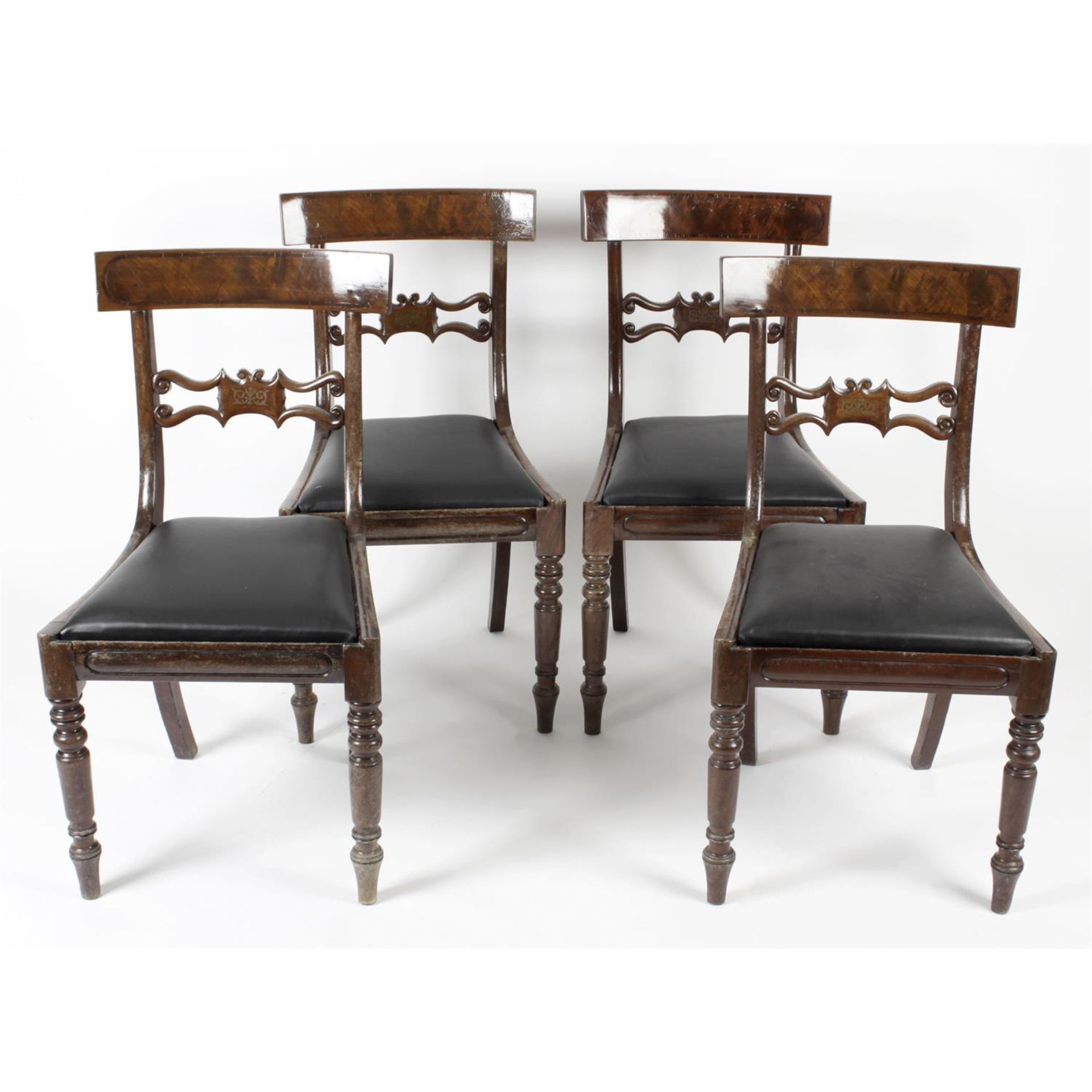 A set of four 19th century mahogany framed dining room chairs.