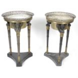 A pair of late 19th century bronze and gilt bronze French empire style wine coolers.