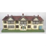 A mid 20th century Triang wooden dolls house.