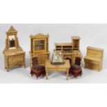 A good selection of early twentieth century stained wooden dolls house furniture.