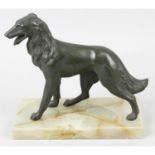 An Art Deco bronzed cast metal study of a dog.