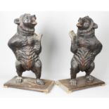 A pair of late 19th century Black Forest carved wooden bears.