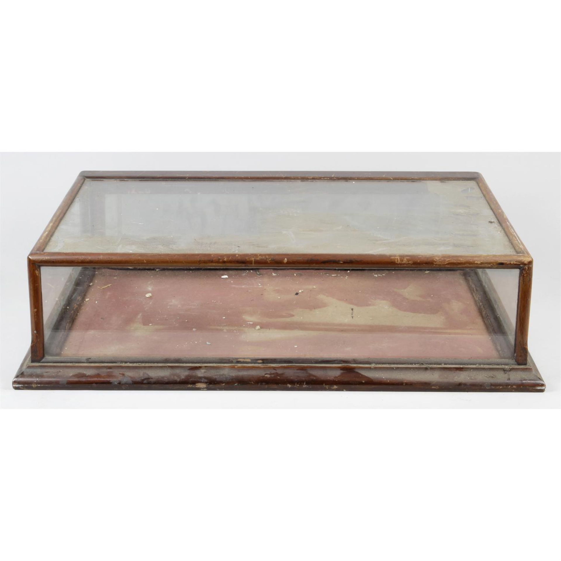 A small early 20th century stained mahogany table top display cabinet.