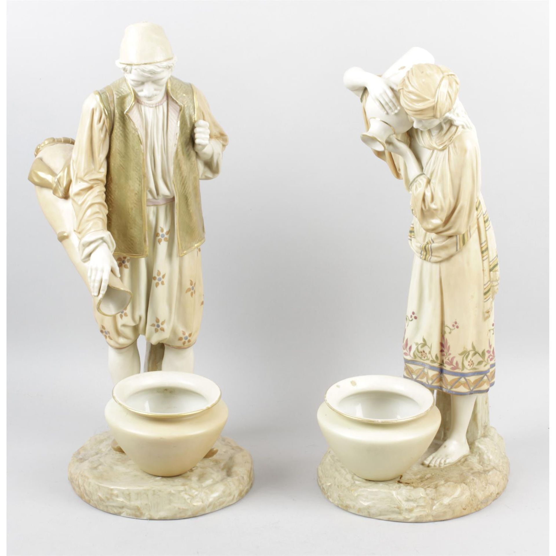 A large impressive pair of Royal Worcester bone china figures designed by James Hadley.