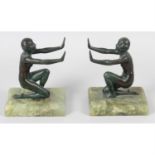 An Art Deco verdigris patinated bronze pair of book ends.