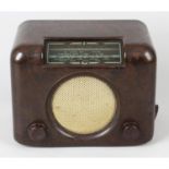 A Bush Brown Bakelite cased radio, together with a cased Singer sewing machine. (2)