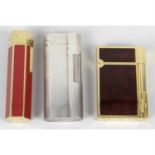 A selection of lighters, to include Dupont and Dunhill examples. (4)