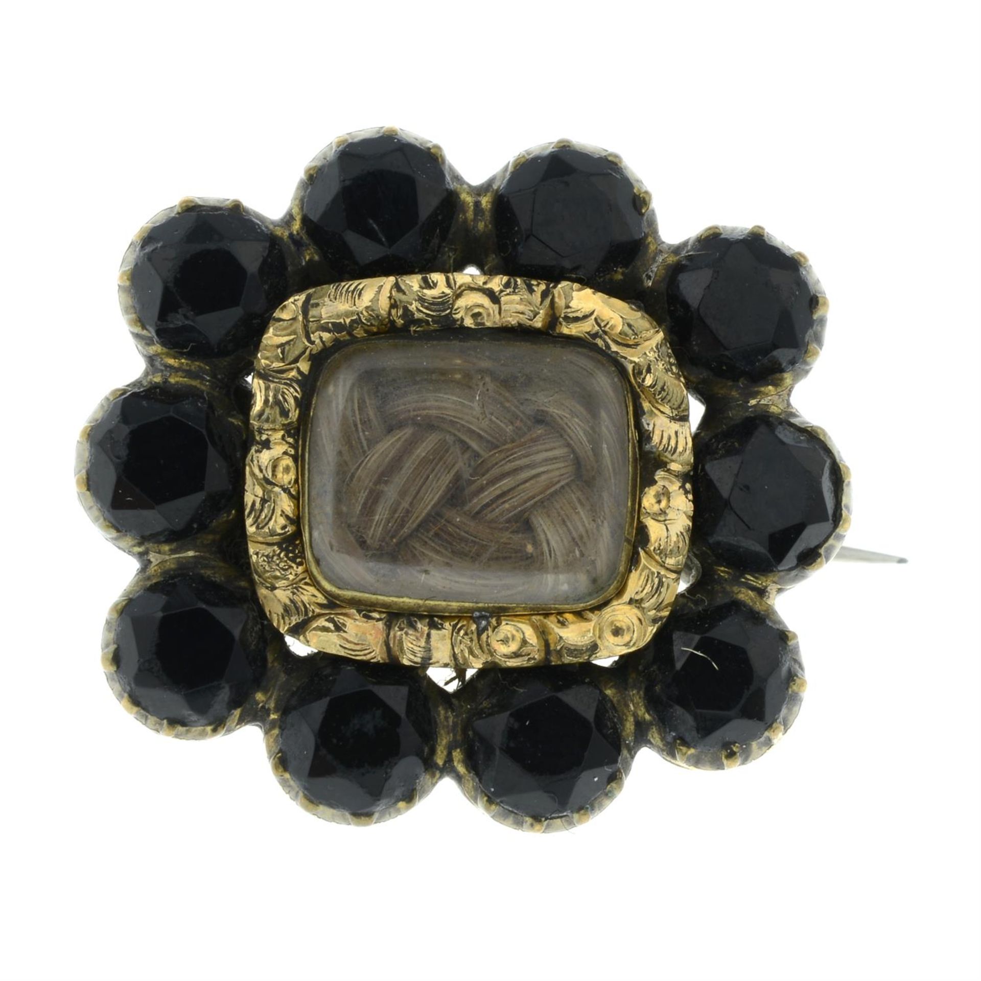 A Victorian paste mourning locket brooch, with hairwork.