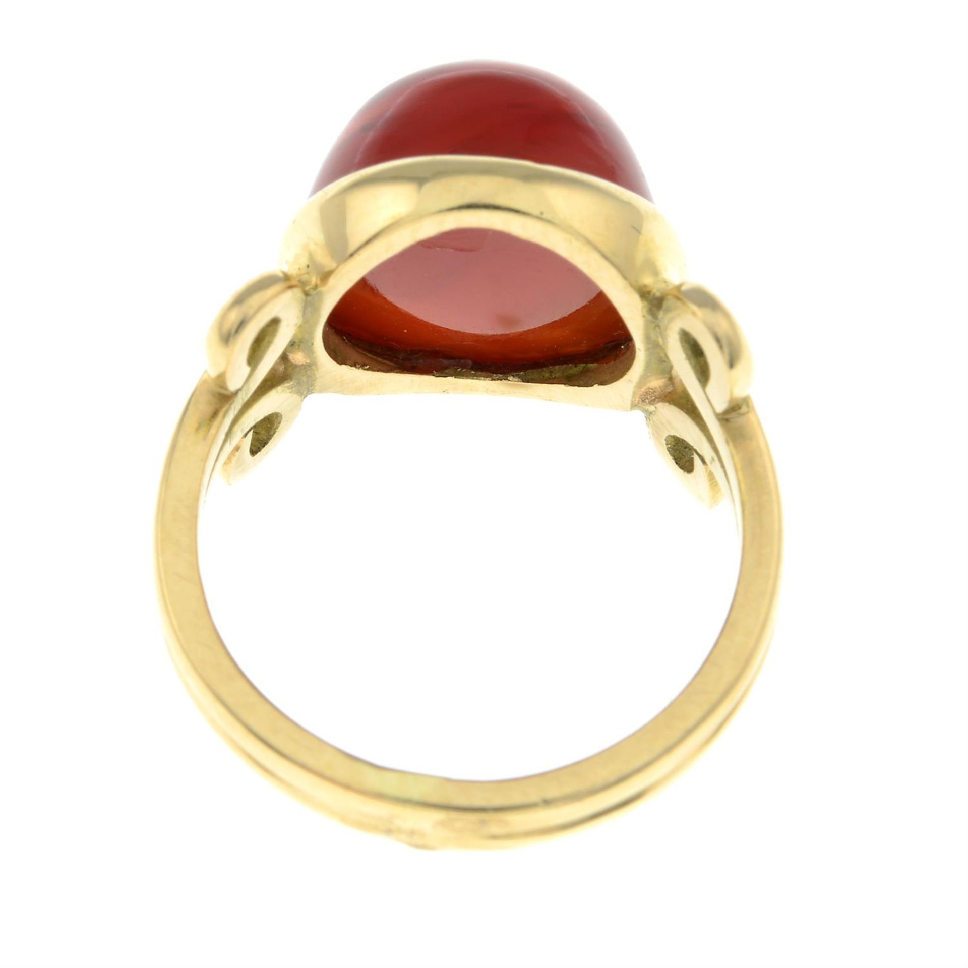 An early to mid 20th century carnelian cabochon dress ring. - Image 2 of 2