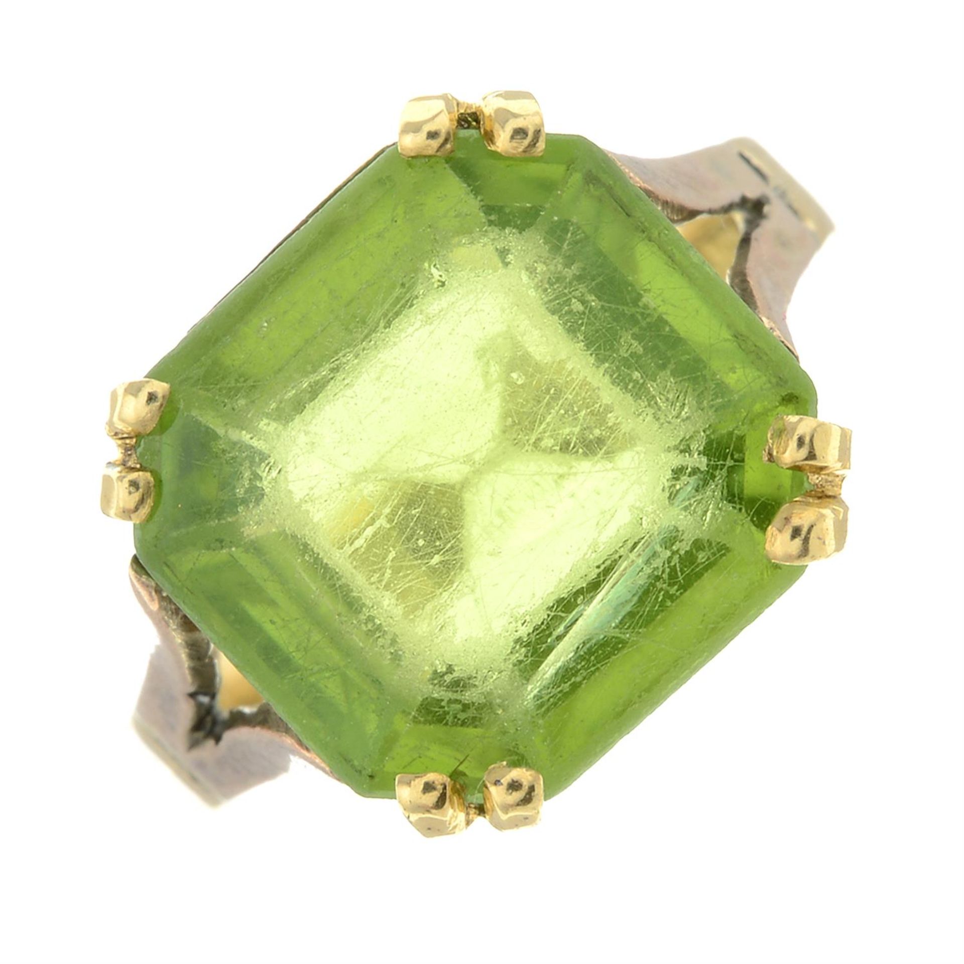 An early 20th century 18ct gold peridot single-stone ring.