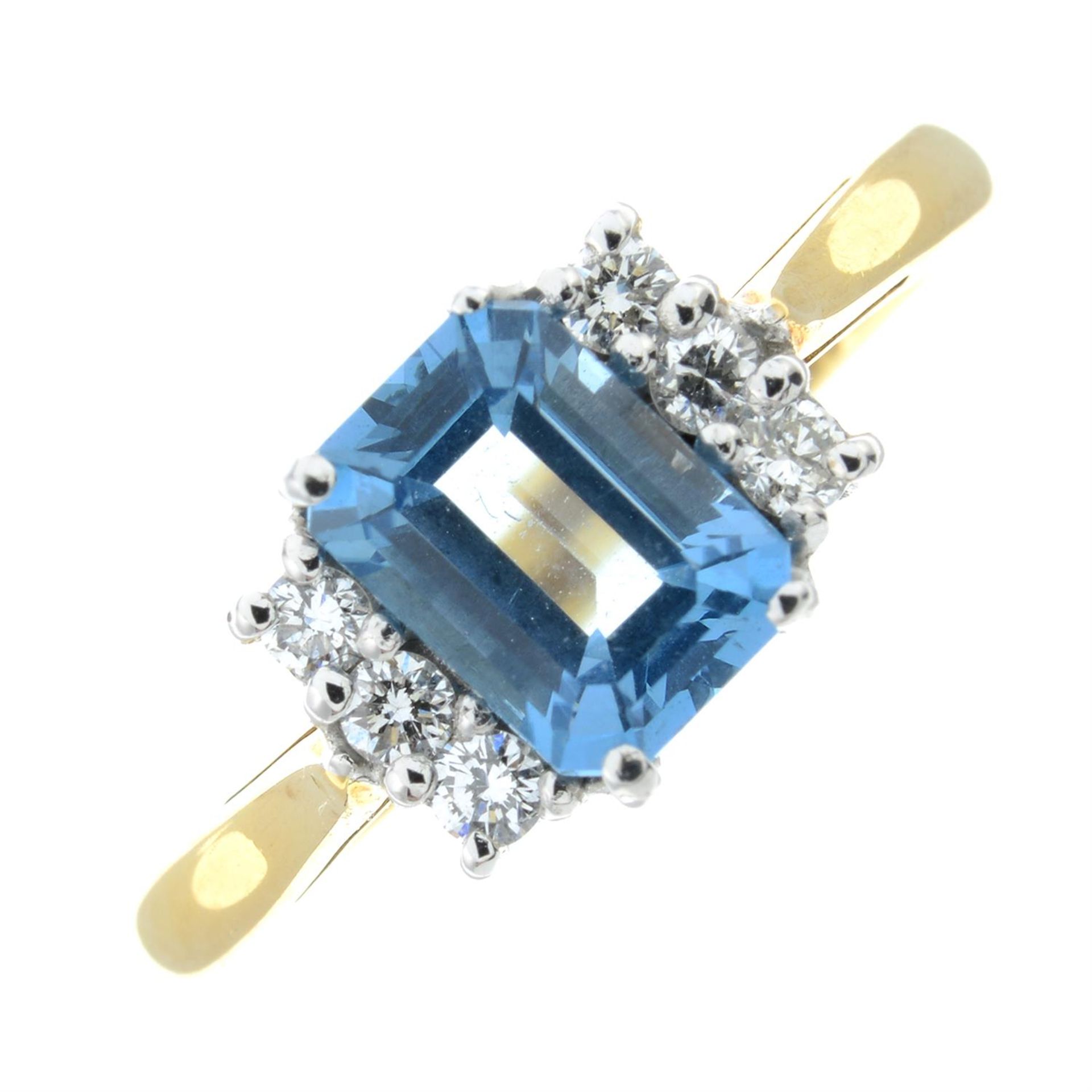 An 18ct gold blue topaz single-stone ring, with brilliant-cut diamond highlights.