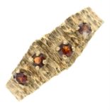 A 9ct gold garnet textured ring.