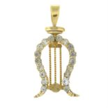 A late 19th century gold colourless paste lyre pendant.