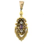 A Victorian gold garnet and paste 'Etruscan Revival' pendant.