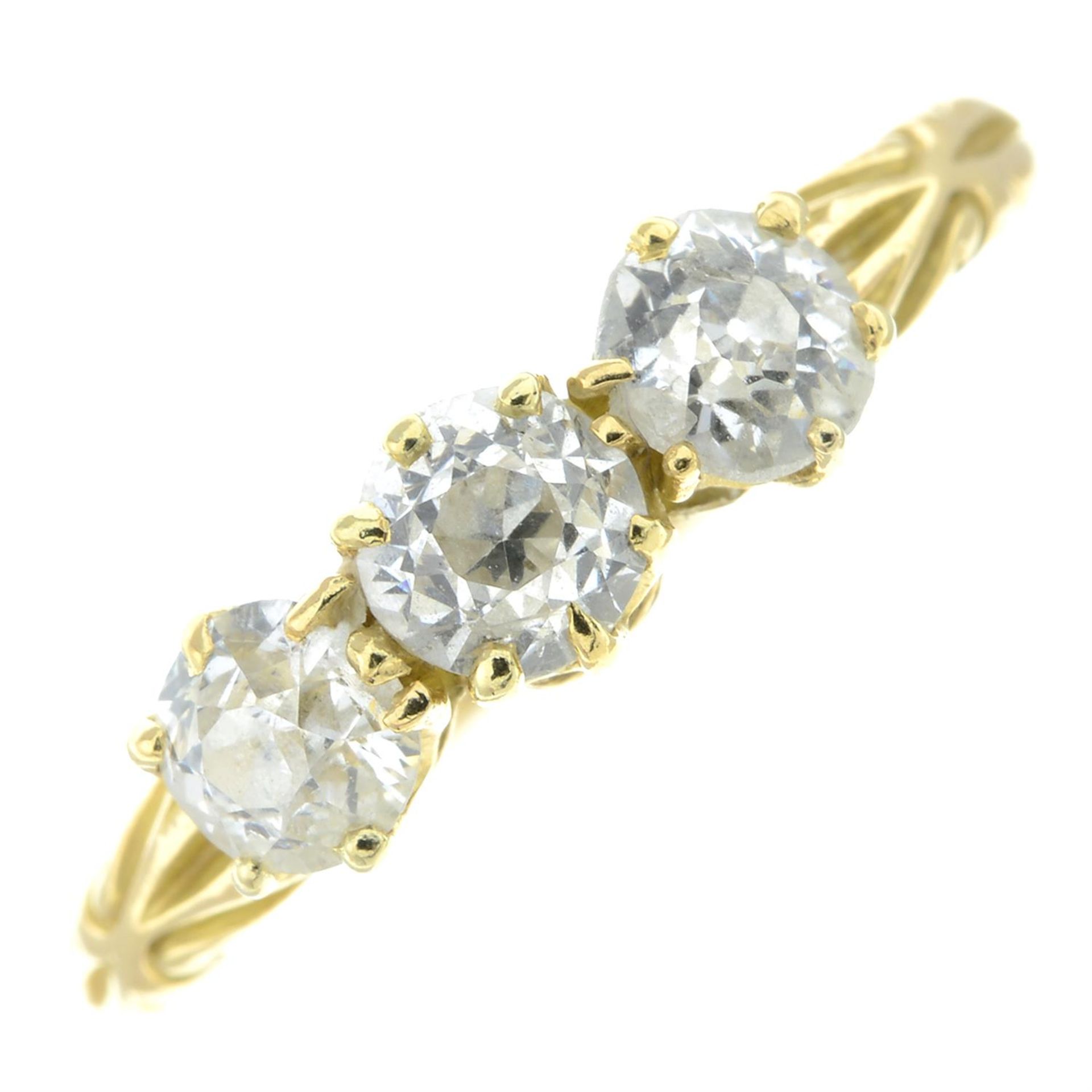 An early 20th century 18ct gold old-cut diamond three-stone ring.