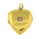 An Edwardian 15ct gold heart-shape locket, with old-cut diamond highlight.