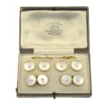 A gentleman's early 20th century 18ct gold seed and mother-of-pearl dress set, comprising pair of