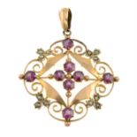 An early 20th century 9ct gold garnet and split pearl openwork pendant.