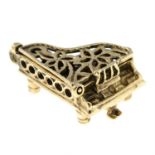 A 9ct gold grand piano charm / pendant.