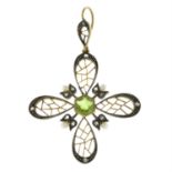 An Edwardian 9ct gold and silver peridot, seed pearl and rose-cut diamond openwork floral pendant.