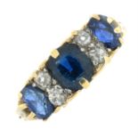 A mid 20th century 18ct gold sapphire three-stone ring, with old-cut diamond double spacers.