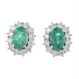 A pair of 18ct gold emerald and brilliant-cut diamond cluster earrings.