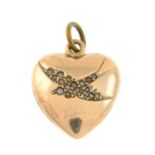 An Edwardian 9ct gold heart-shape pendant, with split pearl swallow detail.