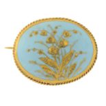 An early 20th century blue porcelain brooch.