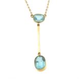 An Edwardian 9ct gold blue paste pendant, with integral chain.