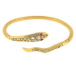 A rose-cut diamond snake bangle, with ruby eyes.