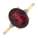 A 9ct gold pinkish-purple garnet single-stone ring, with diamond highlights.