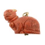 A Victorian carved coral cat pendant.