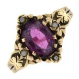 An early 20th century 9ct gold garnet and split pearl ring.