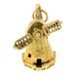 A 1960s 9ct gold windmill charm.