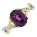 A 9ct gold purple garnet single-stone ring, with colourless zircon shoulders.