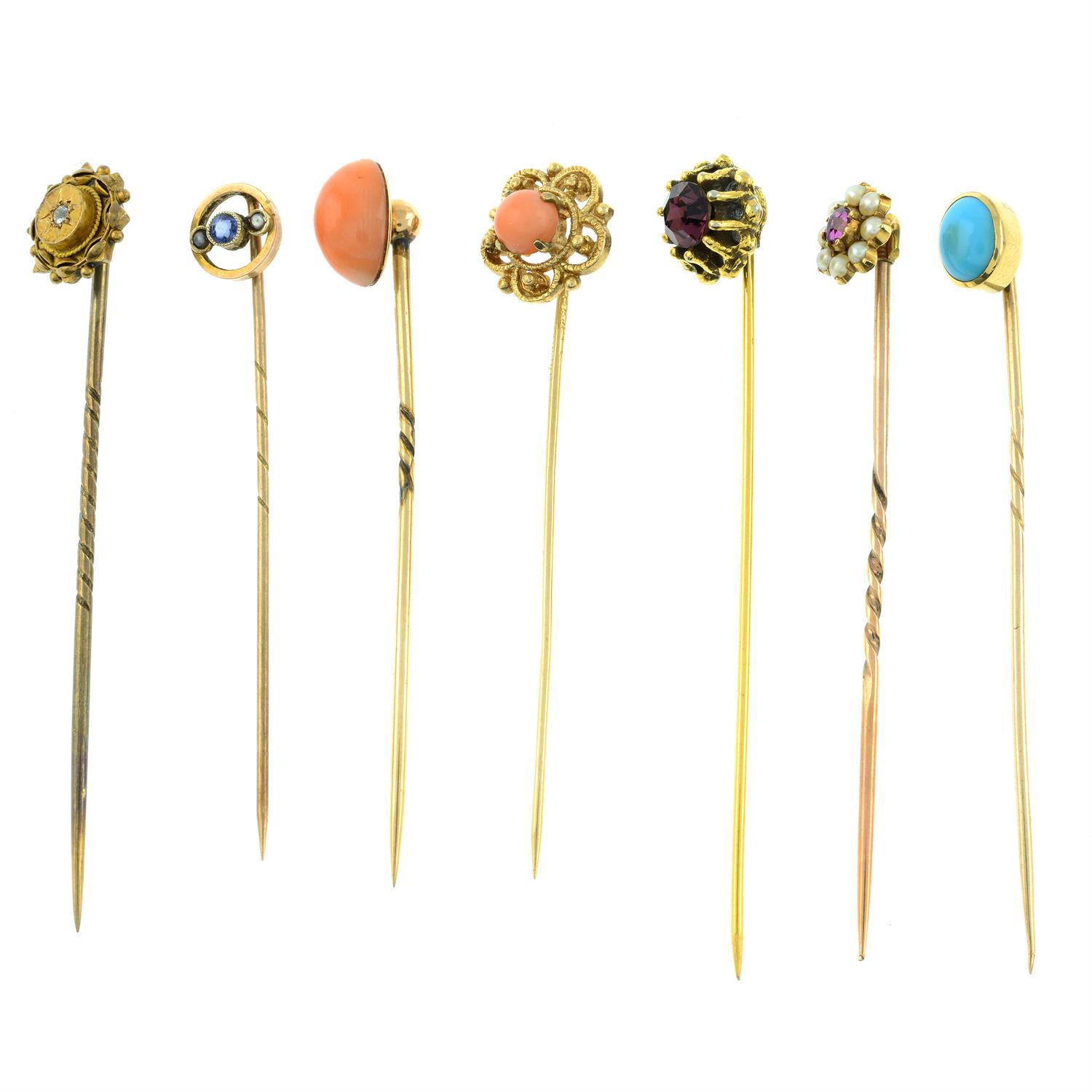 Seven gem-set stickpins.