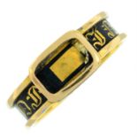 A mid Victorian 18ct gold black enamel mourning ring.