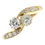 An early 20th century 18ct gold old-cut diamond two-stone crossover ring, with similarly-set