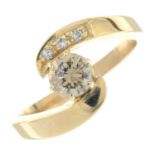 A 14ct gold brilliant-cut 'brown' diamond and diamond crossover ring.