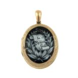 A Victorian 9ct front and back memorial enamel locket.