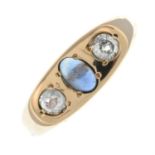 An old-cut diamond and sapphire cabochon three-stone ring.