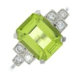 A peridot and brilliant-cut diamond dress ring.