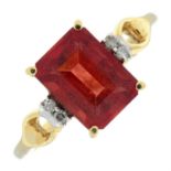 A 9ct gold red andesine single-stone ring, with diamond highlights.