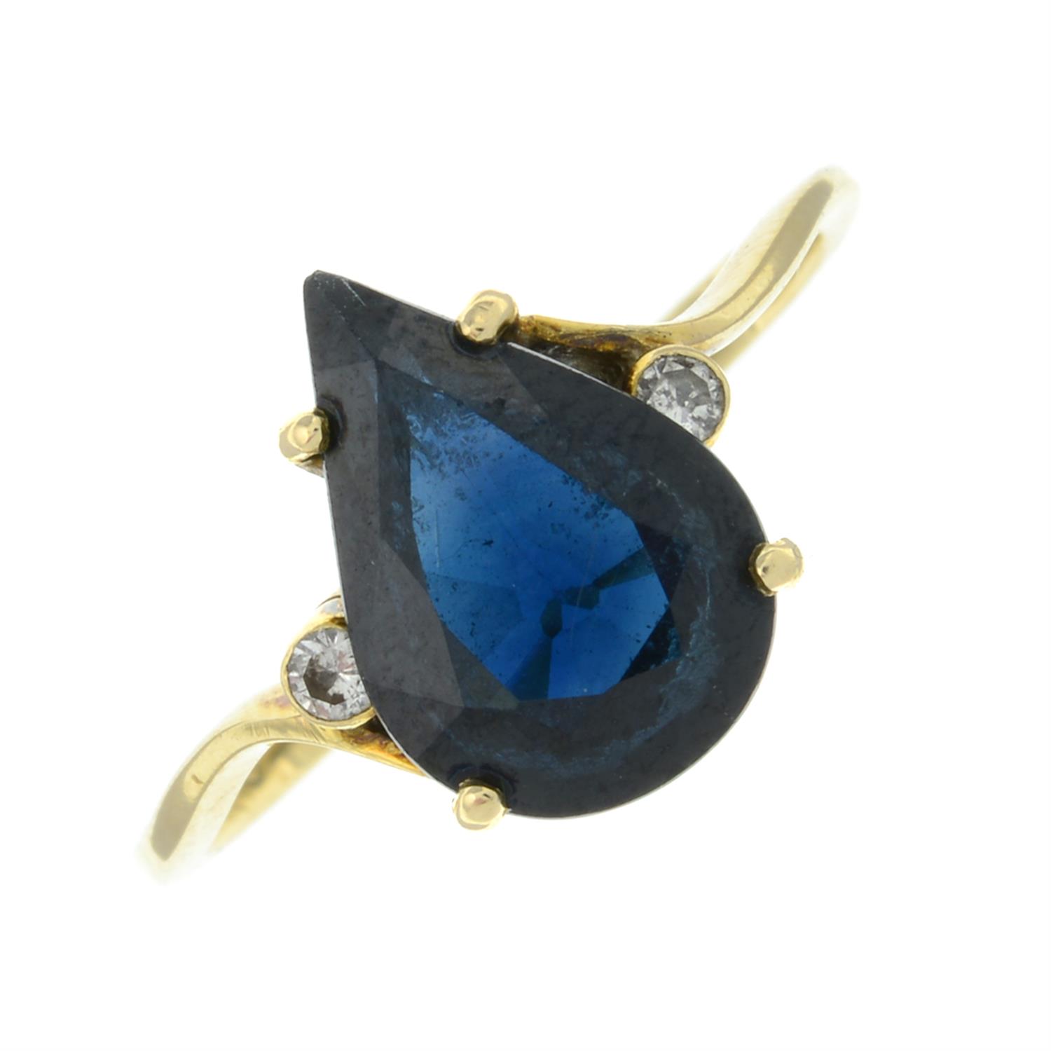 A sapphire and brilliant-cut diamond three-stone ring.